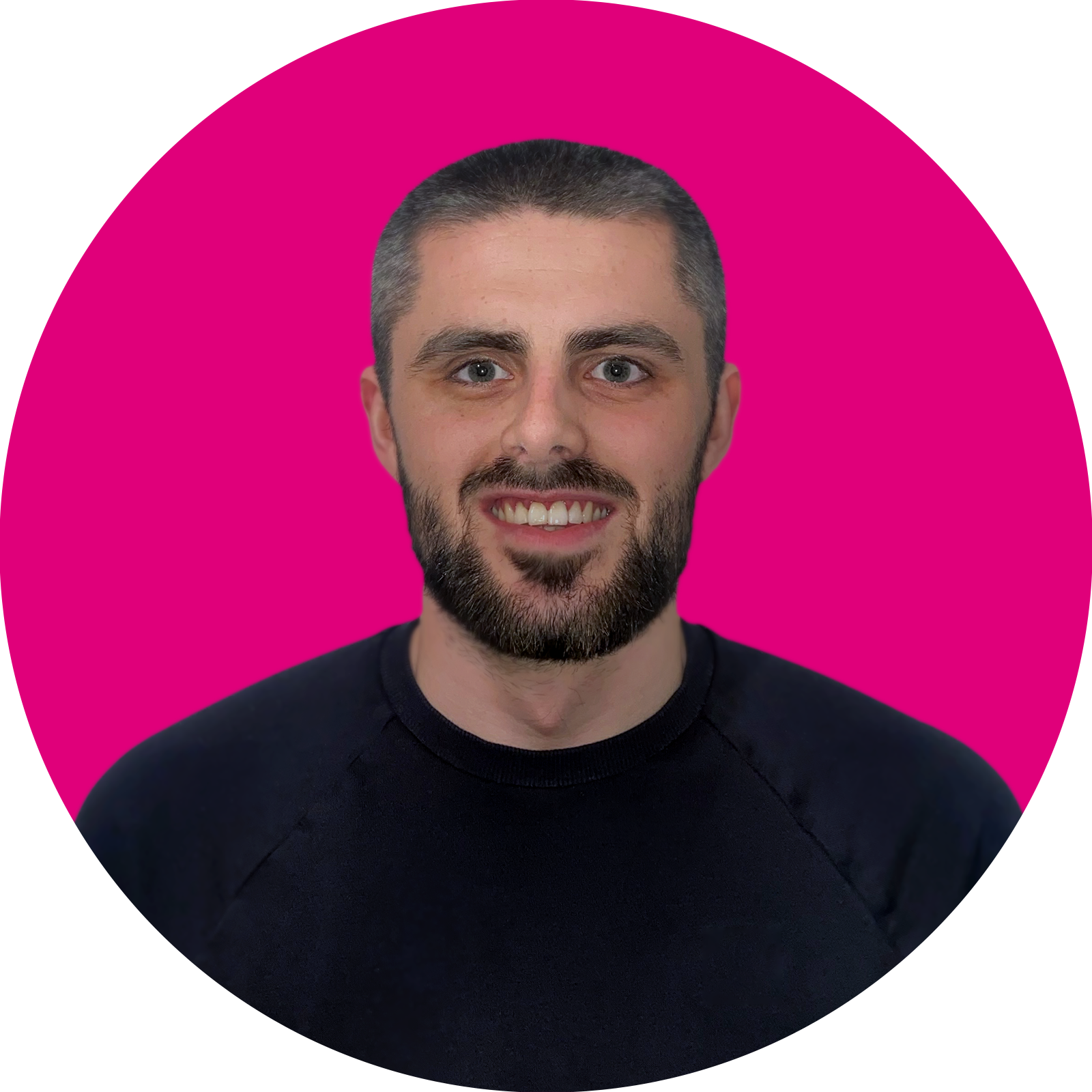 portrait of a man smiling with pink background