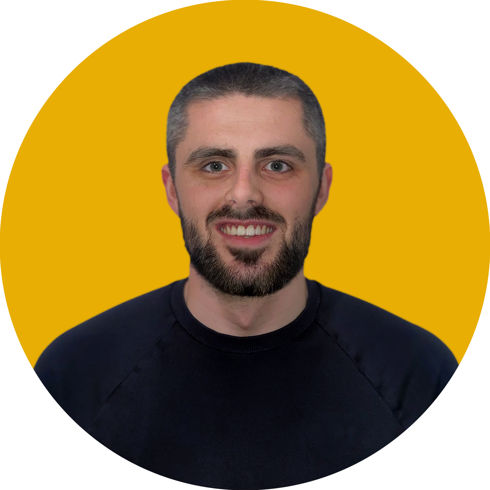 portrait of a man smiling with yellow background