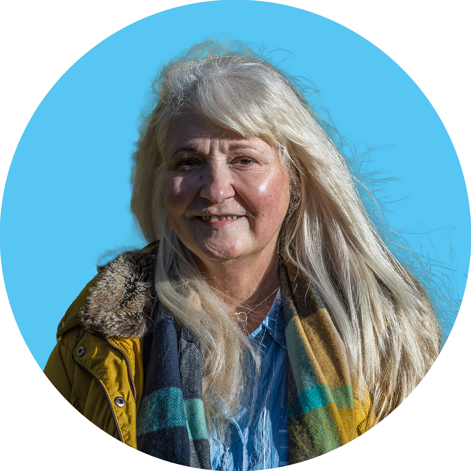 portrait of a woman smiling with blue background