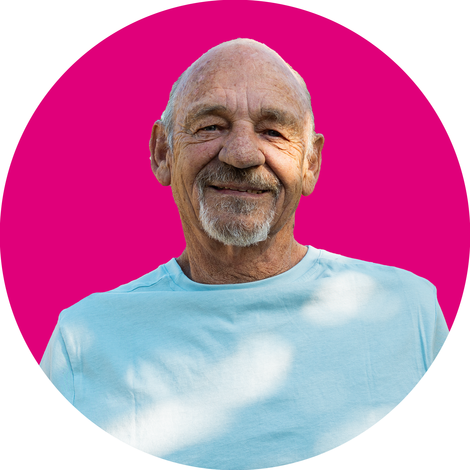 Portrait of an older man smiling with pink background