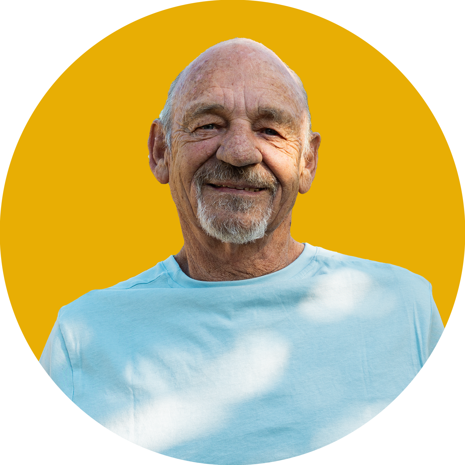 Portrait of an older man smiling with yellow background